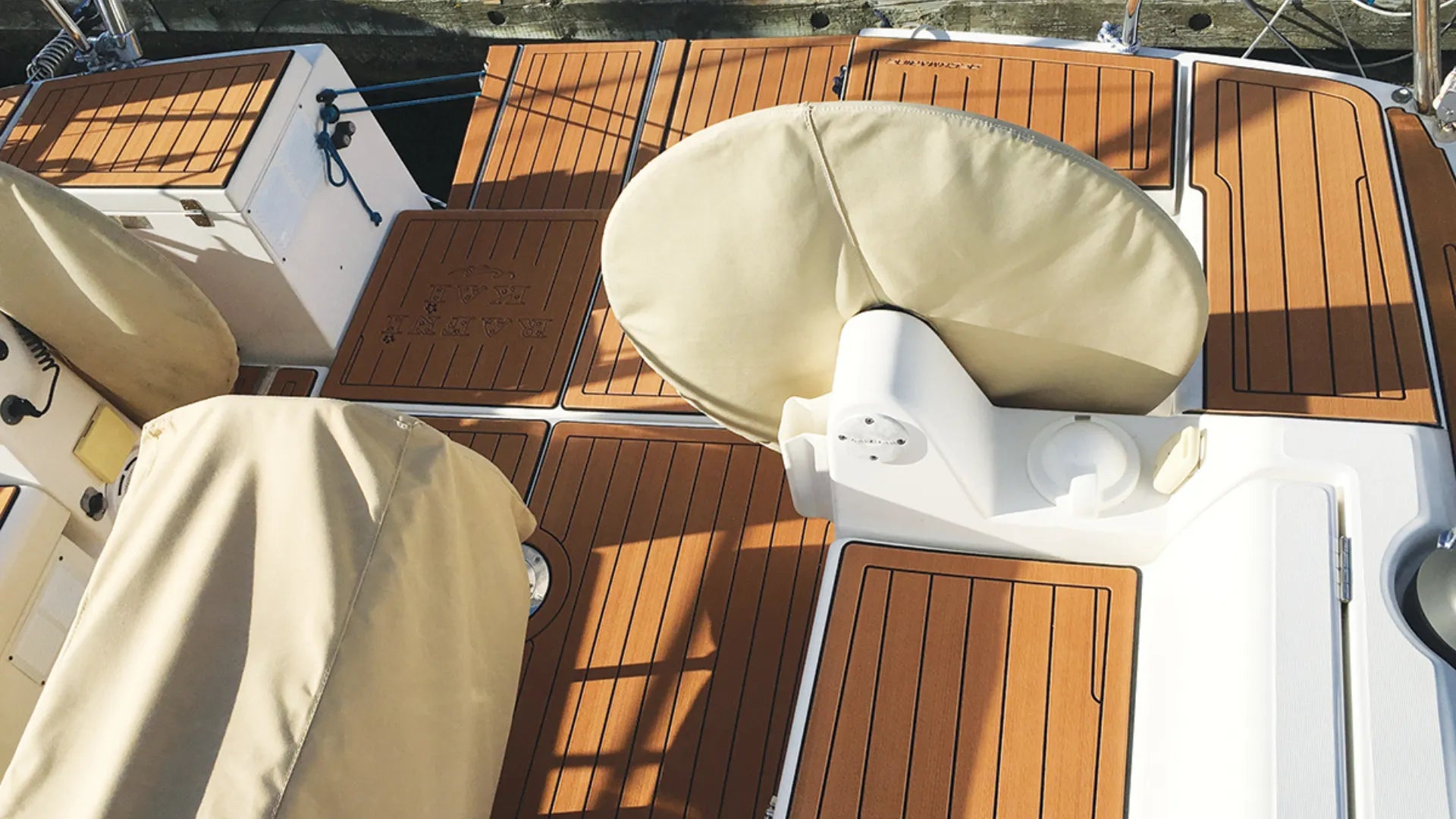 Brown EVA boat flooring with non-slip grip on white boat deck