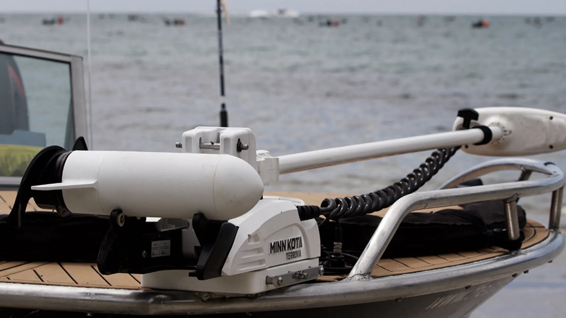 Aluminum boat with tan EVA flooring and Minn Kota motor - BoatFloorings