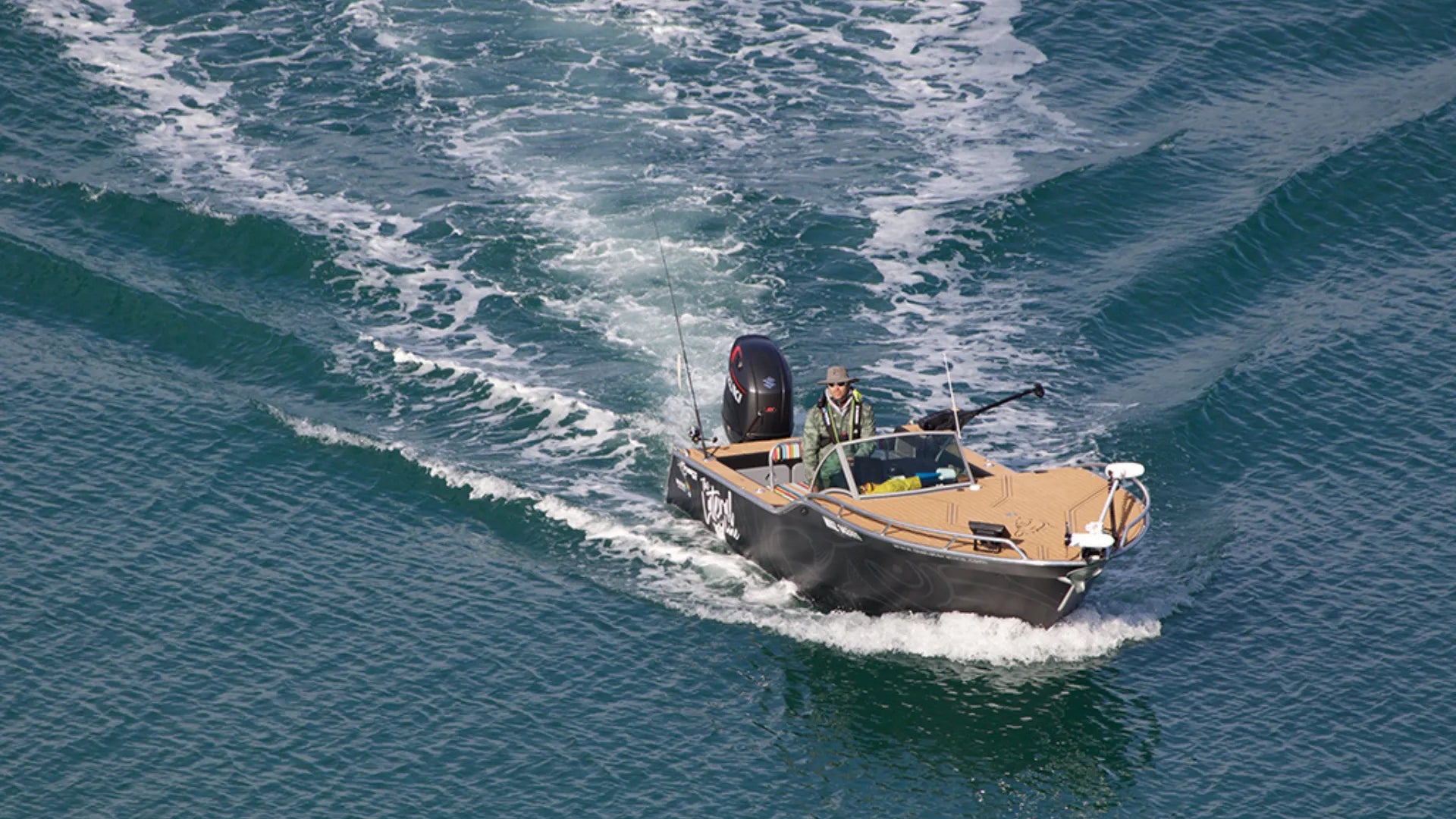 Bass boat with EVA foam deck sailing ocean waves